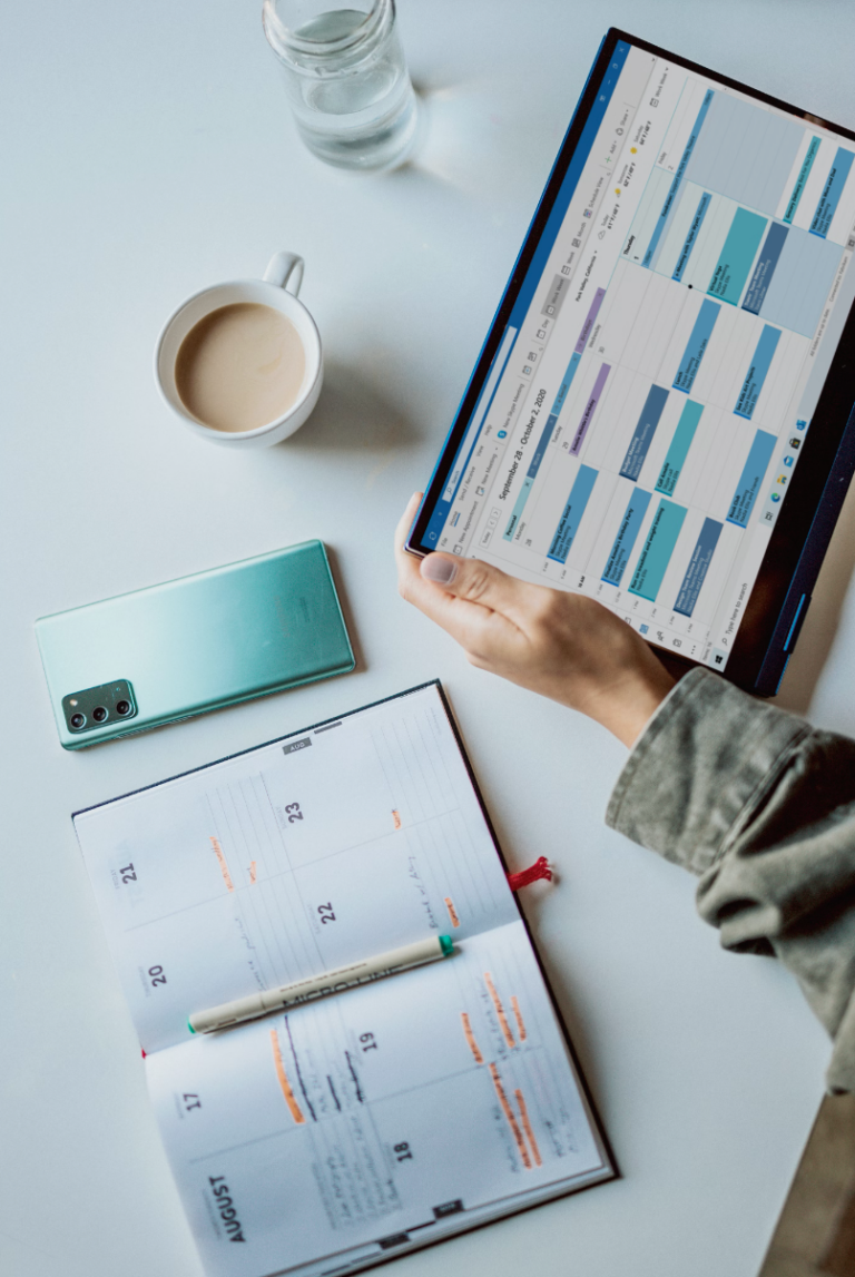 Person using Tablet and calendar.